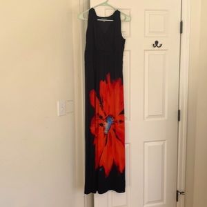 Long dress. Fitted at top. Not fitted under waist.